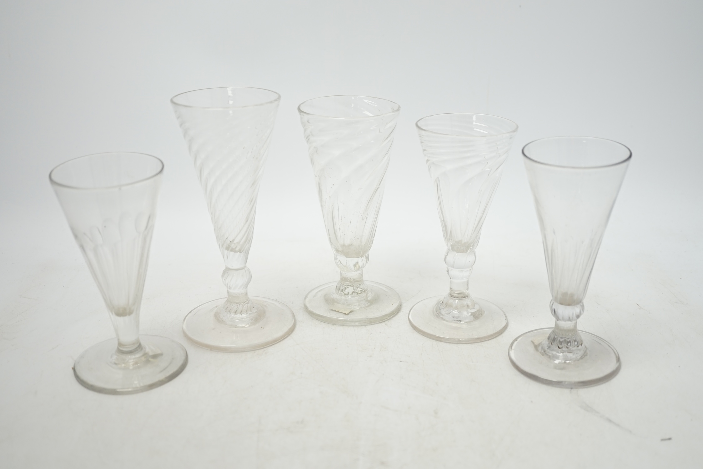 Five mid 18th century wrythen ale glasses, tallest 14.5cm. Condition - good
